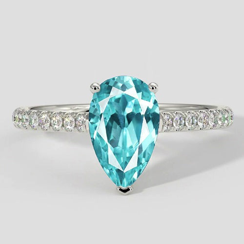 Eleganter Paraiba-Ring im Tropfenschliff mit Pavé