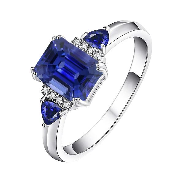 Smaragd-Drei-Steine-Ring mit natürlichem blauem Saphir und Diamanten 3 Karat - harrychadent.ch