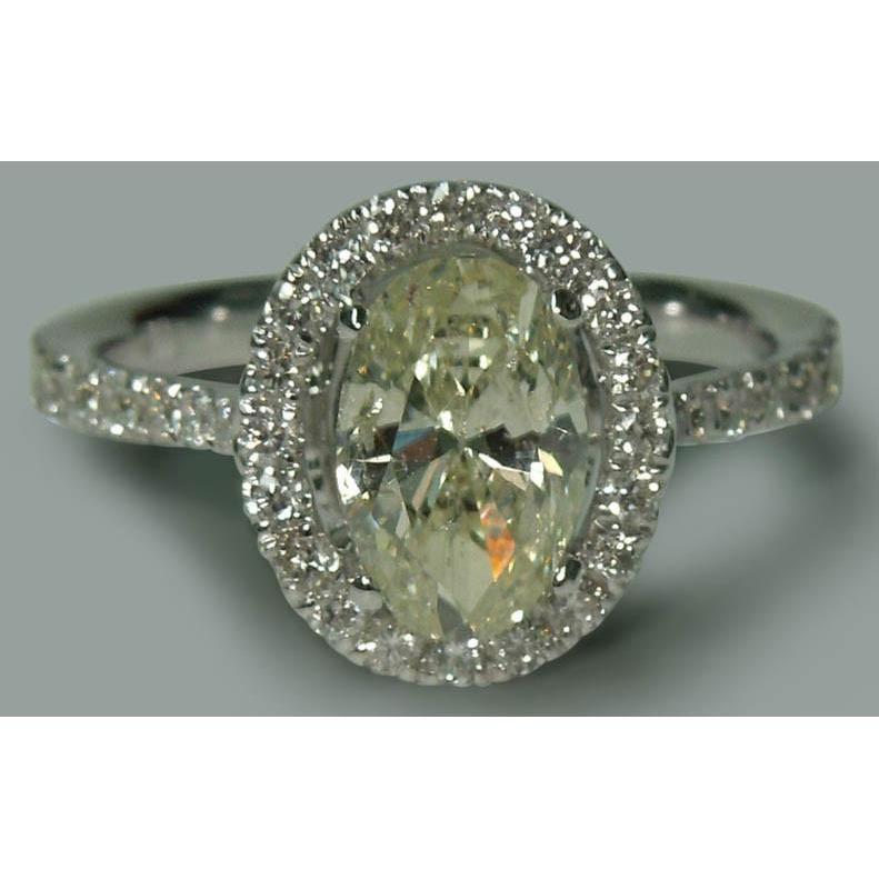 Solitär mit Akzenten 2,03 ct. Ovaler Verlobungsring im Halo-Stil WG 14K