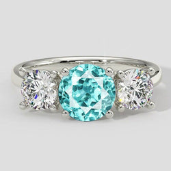 Drei-Stein-Ring mit Paraiba-Turmalin und rundem Diamanten