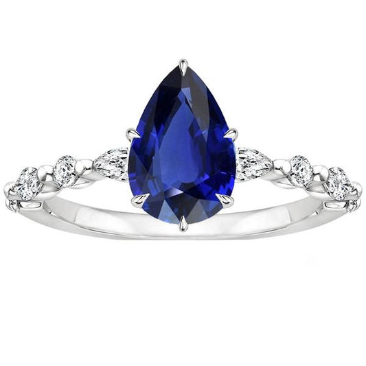 Birnen-Diamant-Jubiläumsring mit blauem Saphir in der Mitte Gold 5 Karat - harrychadent.ch