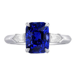 Drei-Steine-Ring mit Smaragd Saphir 3,50 Karat konischer Baguette-Diamant