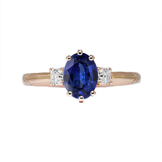 Ovaler blauer Saphirring mit drei Steinen und Diamanten 2,50 Karat - harrychadent.ch